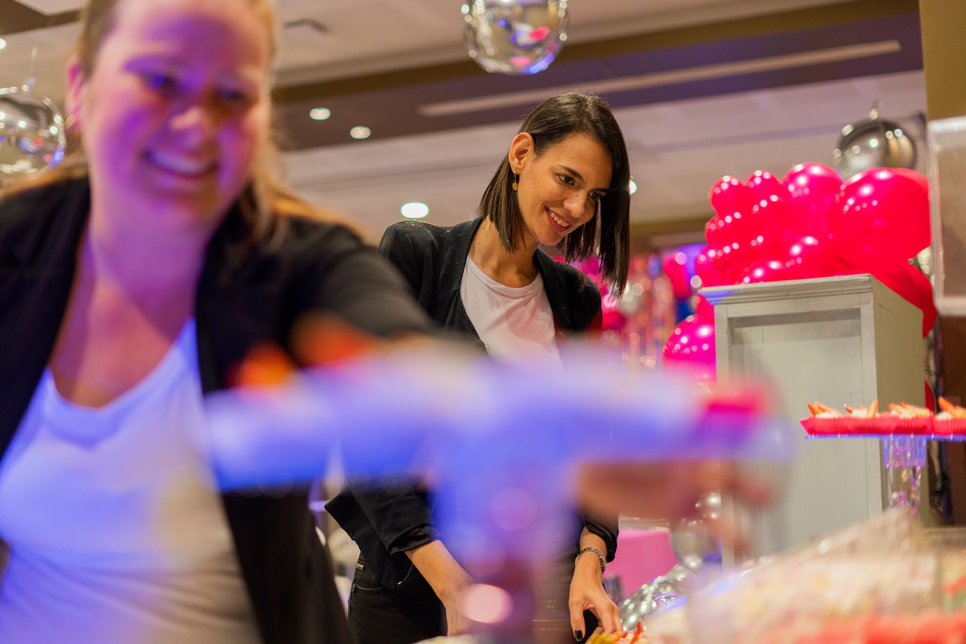 Latin woman event organizer is reviewing the last details of her prepared party